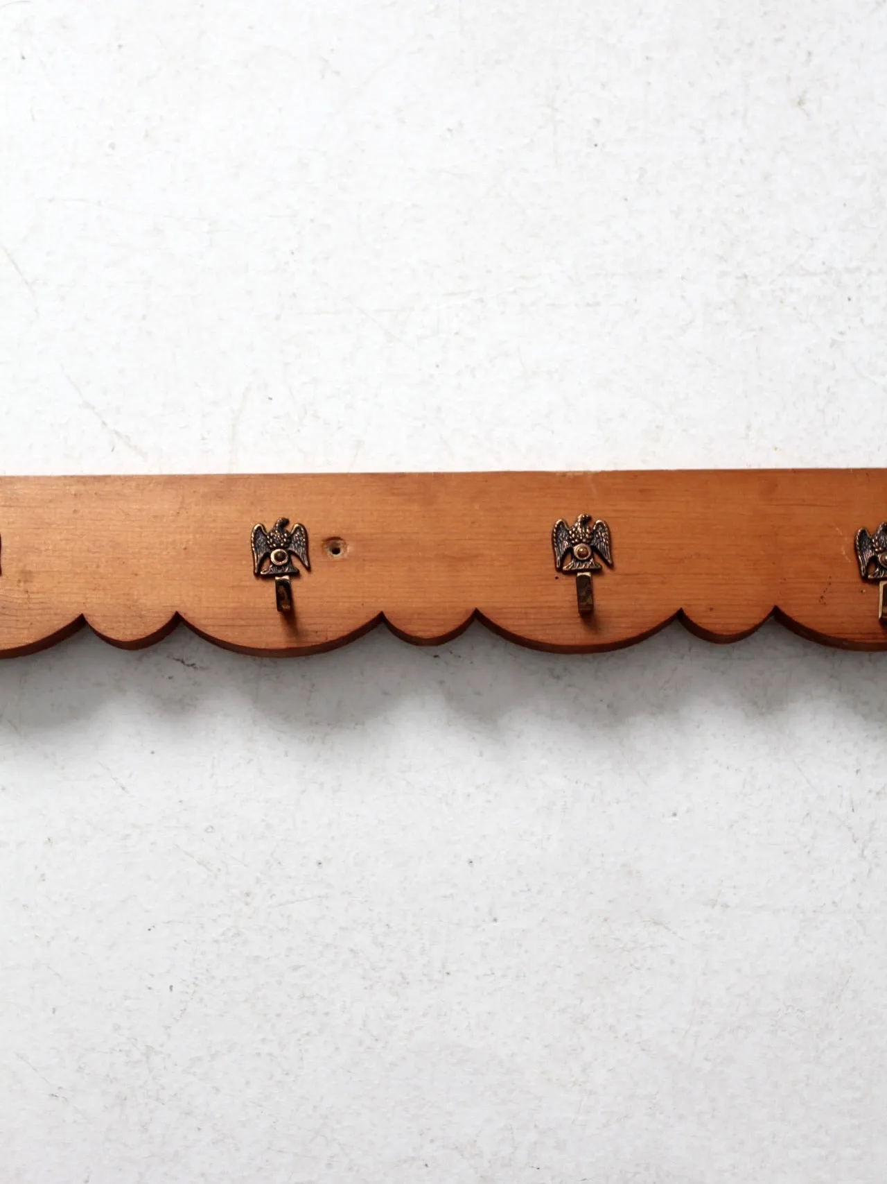 vintage handmade wall rack with eagle hooks