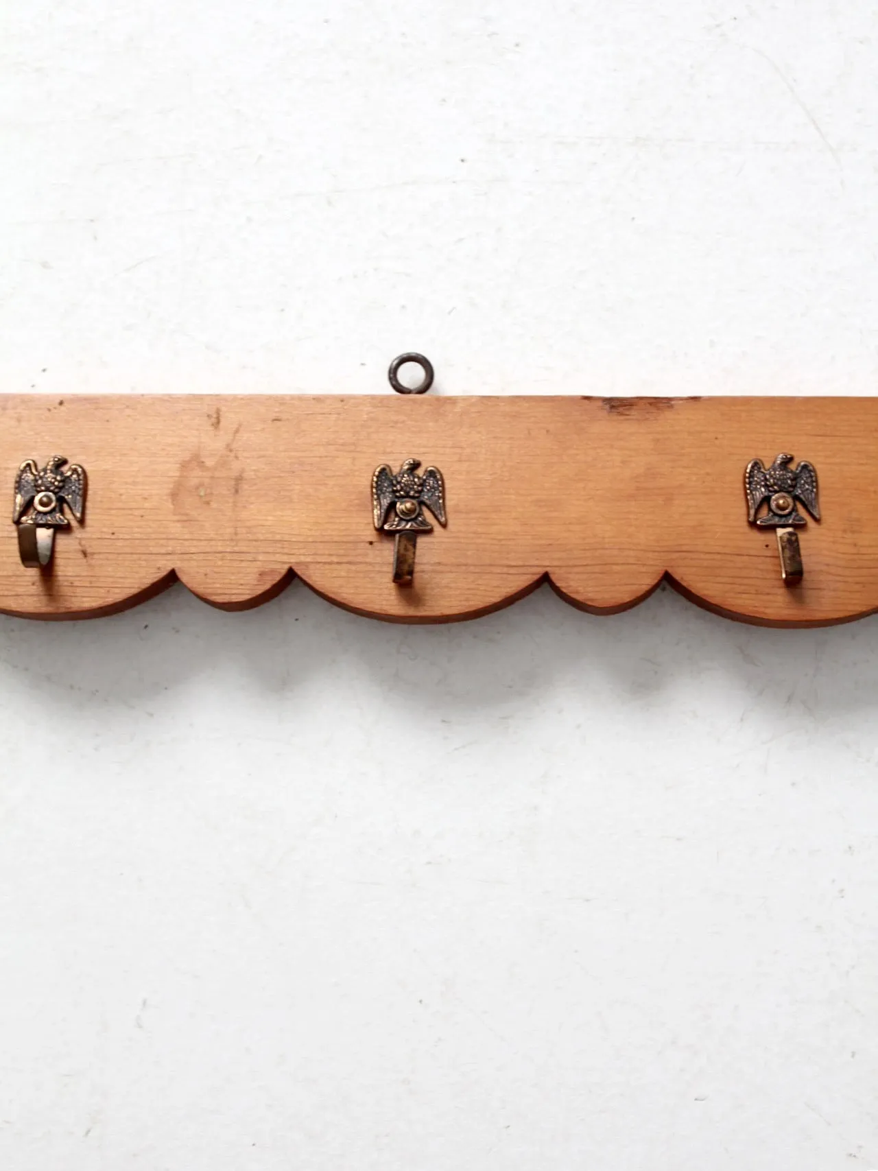 vintage handmade wall rack with eagle hooks